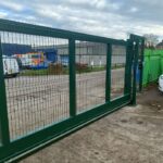 Metal mesh sliding gate installed at an industrial site entrance for enhanced security