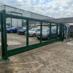 Metal mesh sliding gate installed at the entrance of a parking and storage area