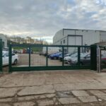 Metal mesh sliding gate installed at the entrance of an industrial premises