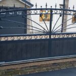 Bespoke driveway gate with decorative sunburst design