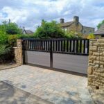 Flat top composite driveway gate with composite boards and metal frame