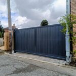 Modern flat top composite gate with a solid metal-framed design