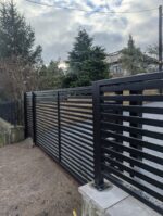 Modern steel sliding gate in black fitted in leeds